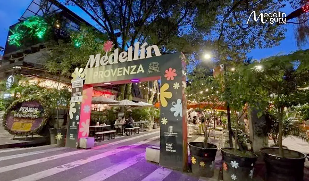 Illuminated entrance to Provenza neighborhood in Medellín, signaling a popular spot for evening dining and nightlife near Parque Lleras
