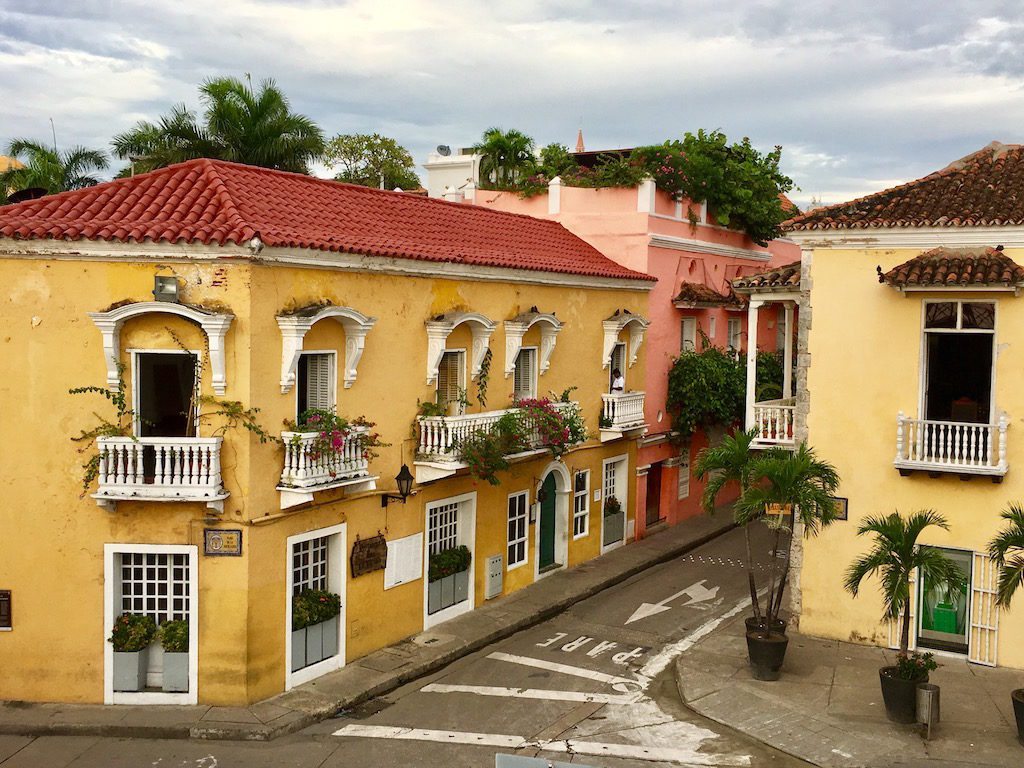 Pastel-colored colonial homes with flower-clad balconies await each visitor to the enchanting historical city of Cartagena