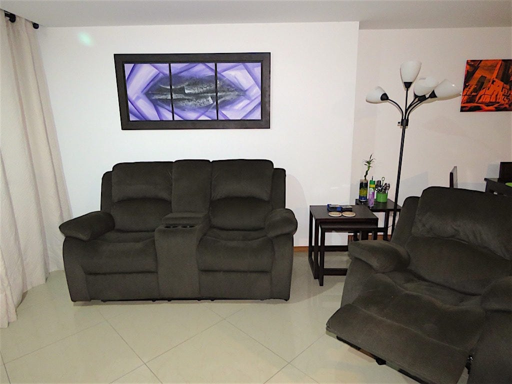 Inside our apartment with 2-piece TV sofa and chair