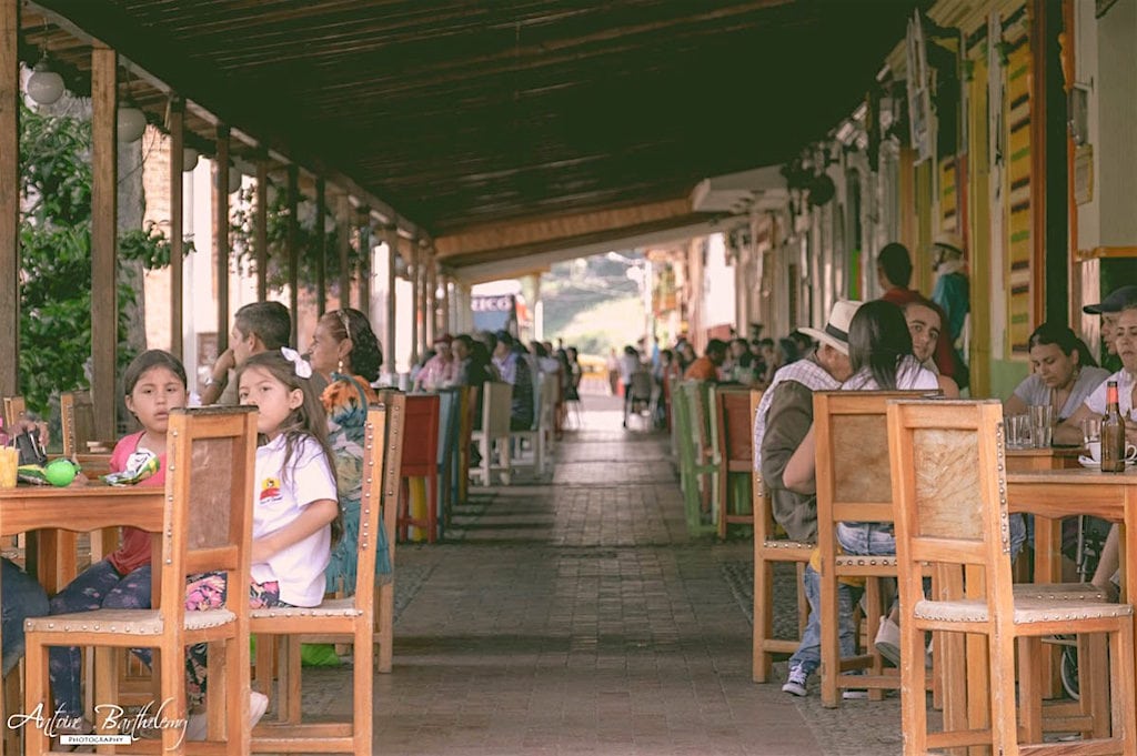 The long line of seating area in front of cafes around the Plaza in Jericó
