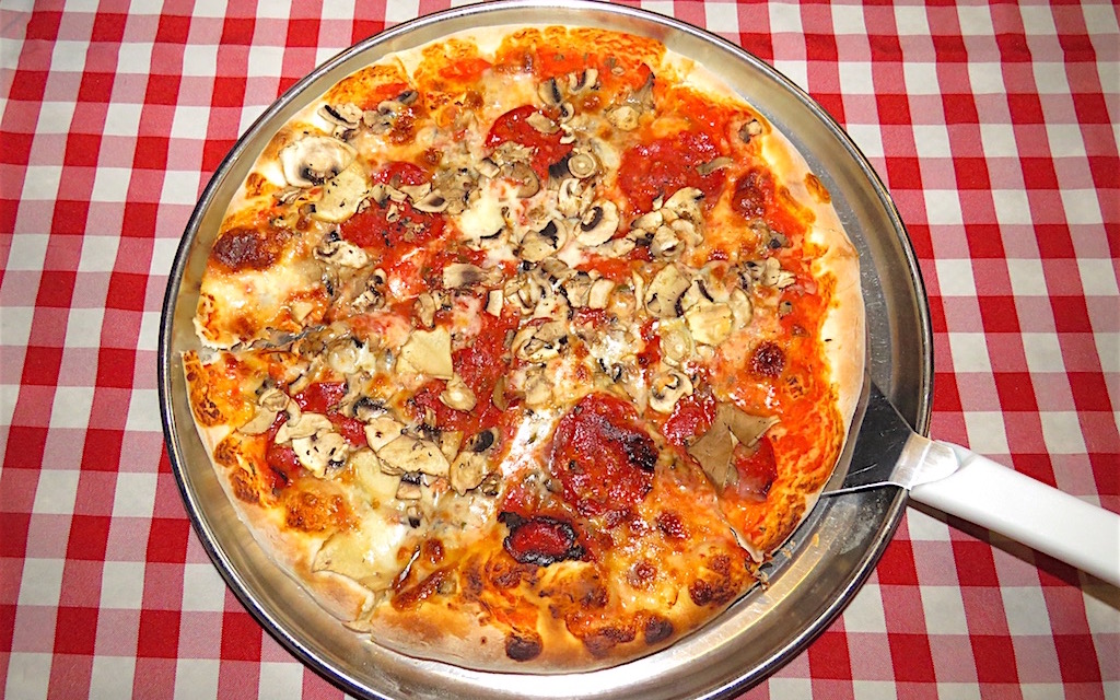 Pepperoni pizza with mushrooms at Opera: A Popular Pizzeria in Laureles, Medellín with Good Pizza - Medellin Guru