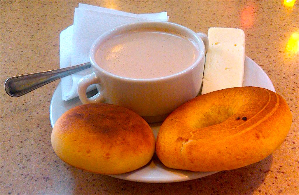A traditional breakfast from Colombia - hot chocolate, cheese (mozzarella), and two kinds of bread, photo by Peter Angritt