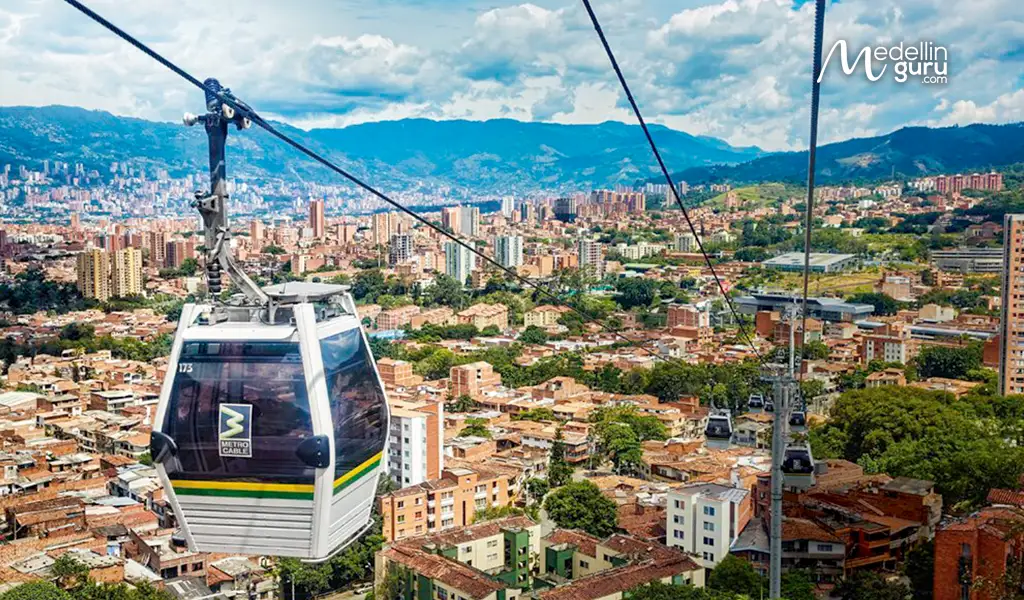 Medellin Metrocable cabin providing panoramic views over the city's vibrant neighborhoods