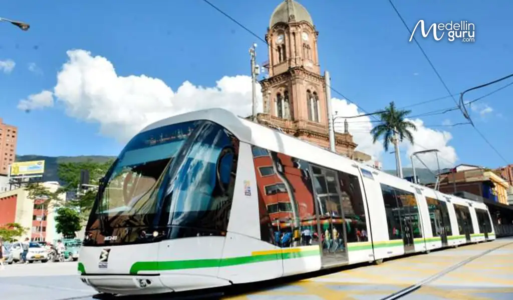 Medellin's modern Ayacucho Tram (Tranvía) at Bicentenario station, alongside vibrant urban art