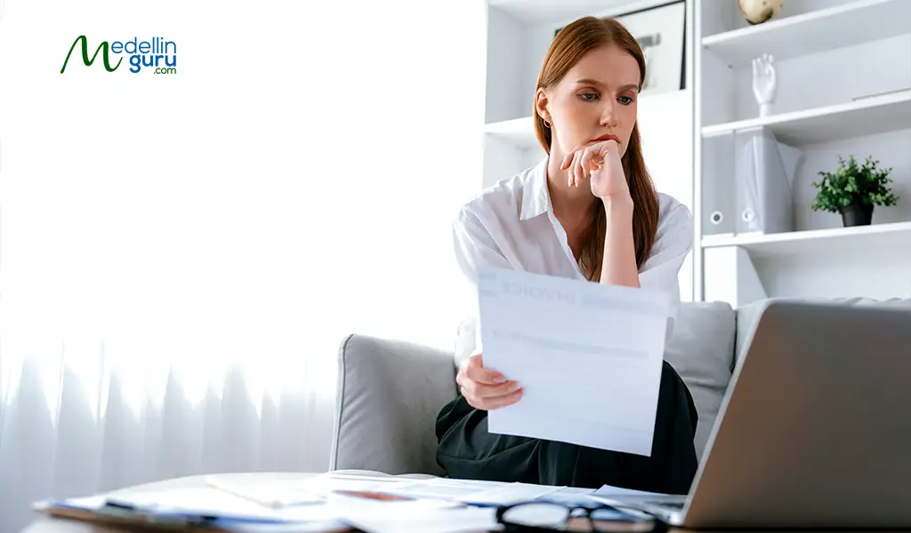Frustrated applicant reflecting on the denial of their digital nomad visa in Colombia due to expiring documents