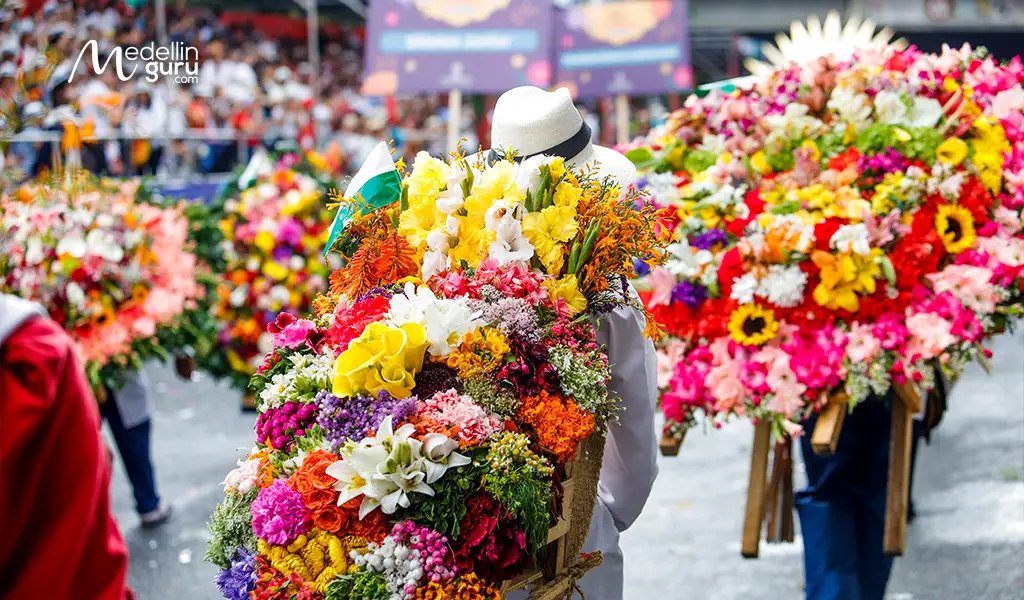 Close-up of silleteros presenting their intricate floral creations. Photo by Telemedellín