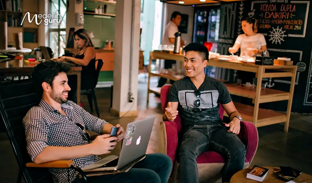 Diverse group of digital nomads engaged in remote work, reflecting the community affected by Colombia's visa policies in 2025