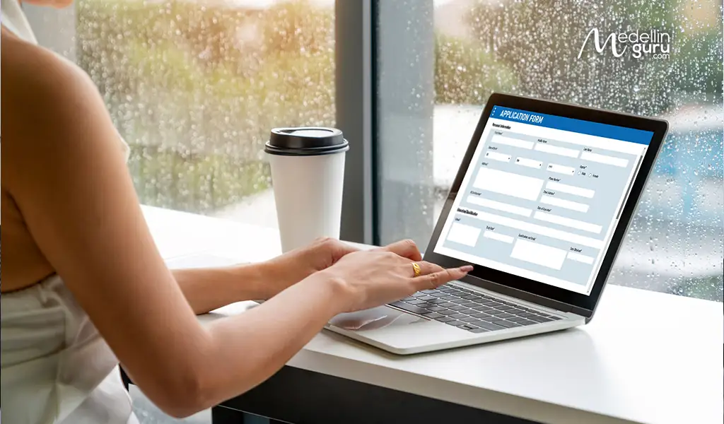 Person completing a visa application, representing the rigorous screening process for digital nomad visas