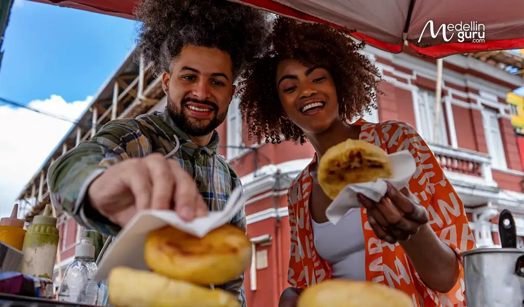 Delicious colombian food being shared among friends during their 'parche