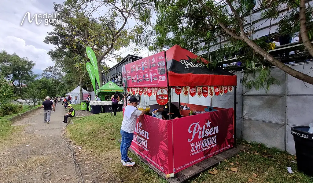 Locals buying cold beer and aguardiente at official locals while celebrating the parade