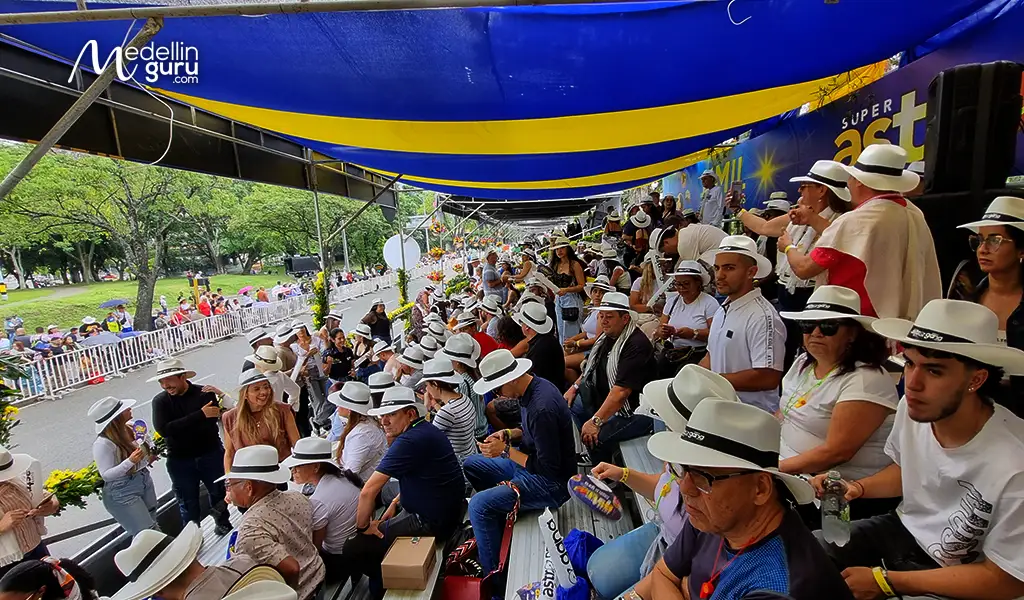 Excited crowd dancing and celebrating during the parade despite light rain