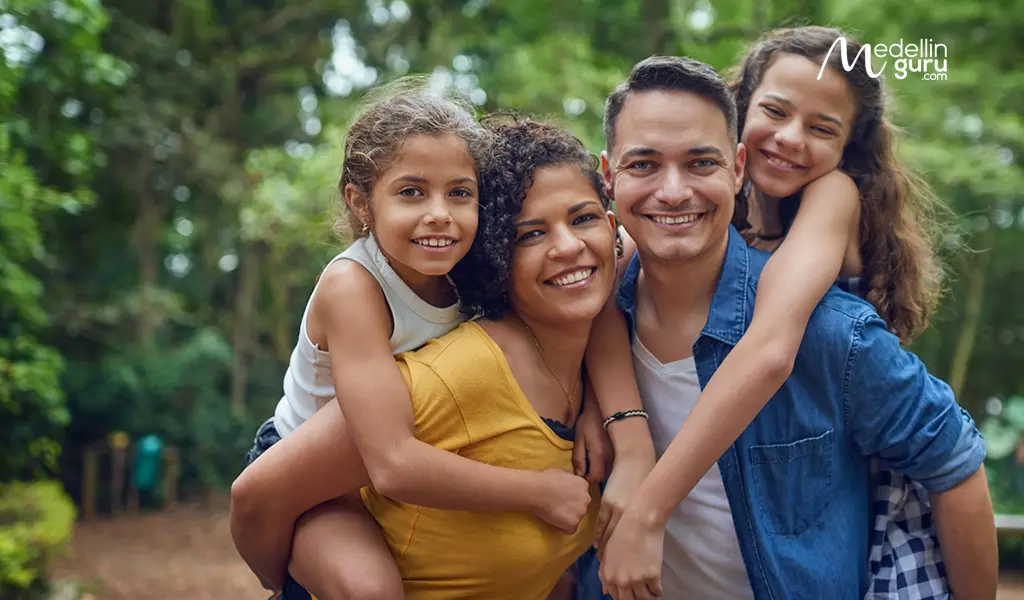 A happy family with children in Colombia, outlining visa paths for dependents and spouses