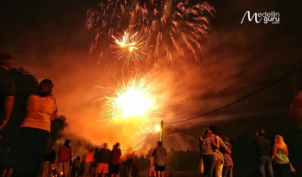 Crowd watching s pólvora fireworks explode at night during Christmas in Colombia