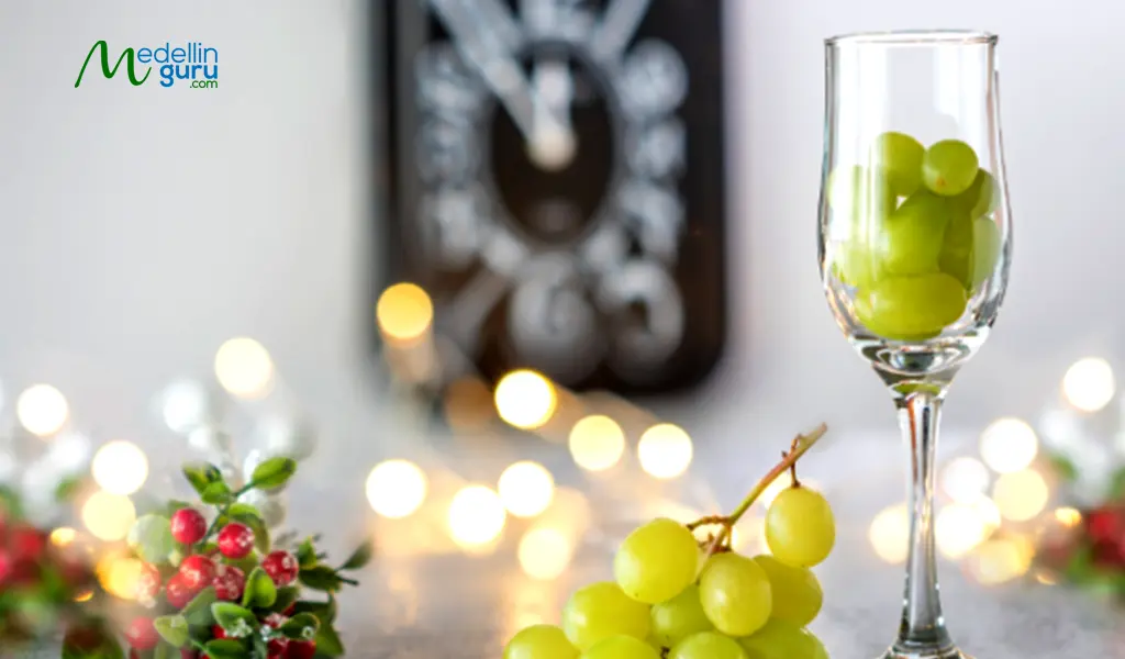 Twelve grapes and champagne on New Year’s eve ritual for good luck