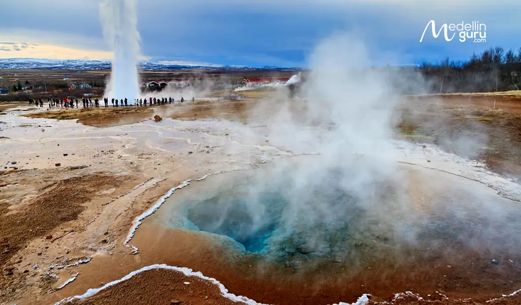 Eruption of the Strokkur geyser in the Geysir geothermal area, an iconic stop along Iceland's Golden Circle route.