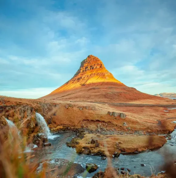 Landscape of the Snæfellsnes Peninsula with Mount Kirkjufell in the background.